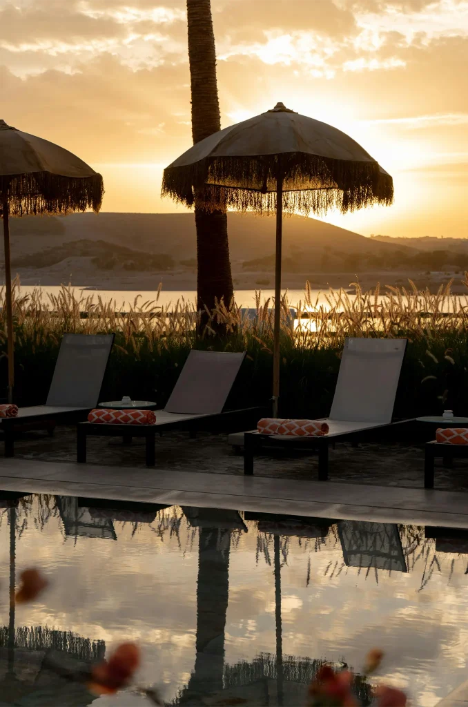 Tranquil Poolside Sunset at a Tropical Resort. Photo by Pure house On the lake