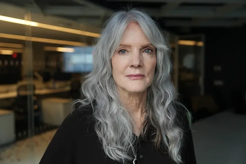 Maggie Baird, mother of world-famous musicians Billie Eilish and Finneas, poses for a photo Monday, Sept. 22, 2025, in New York. Baird founded Support + Feed, which is a nonprofit that advocates for a more climate-friendly food system and provides plant-based meals to people in need. (AP Photo/Mary Conlon)