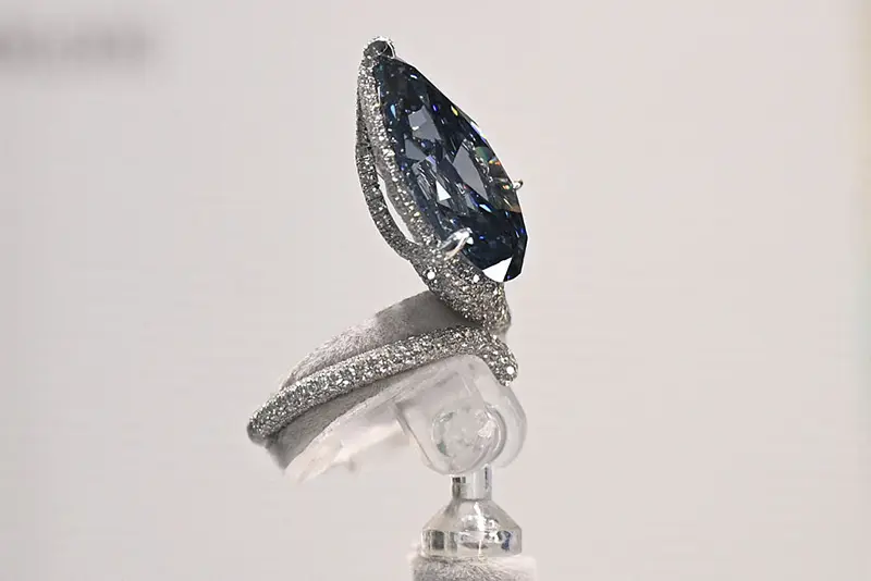 The Mellon Blue, a fancy Vivid Blue pear-shaped cut diamond of 9.51 carats which once belonged to Bunny Mellon, the American Garden Queen, is seen at a Christie's auction preview in Hong Kong on October 23, 2025. It will be auctioned on November 11, 2025 in Geneva, Switzerland for an estimated USD 20,000,000 - 30,000,000. (Photo by Peter PARKS / AFP) (Photo by PETER PARKS/AFP via Getty Images)