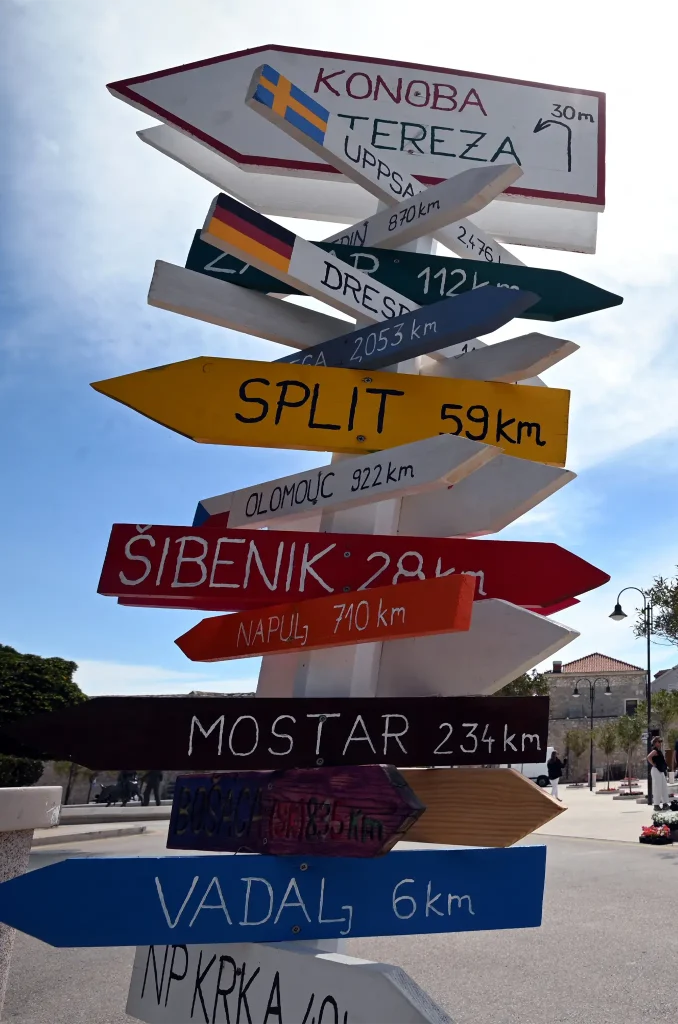 Signs on the promenade near the artificial beach at Primosten a coastal town in Croatia on May 9, 2025. (Photo by ELVIS BARUKCIC/AFP via Getty Images)