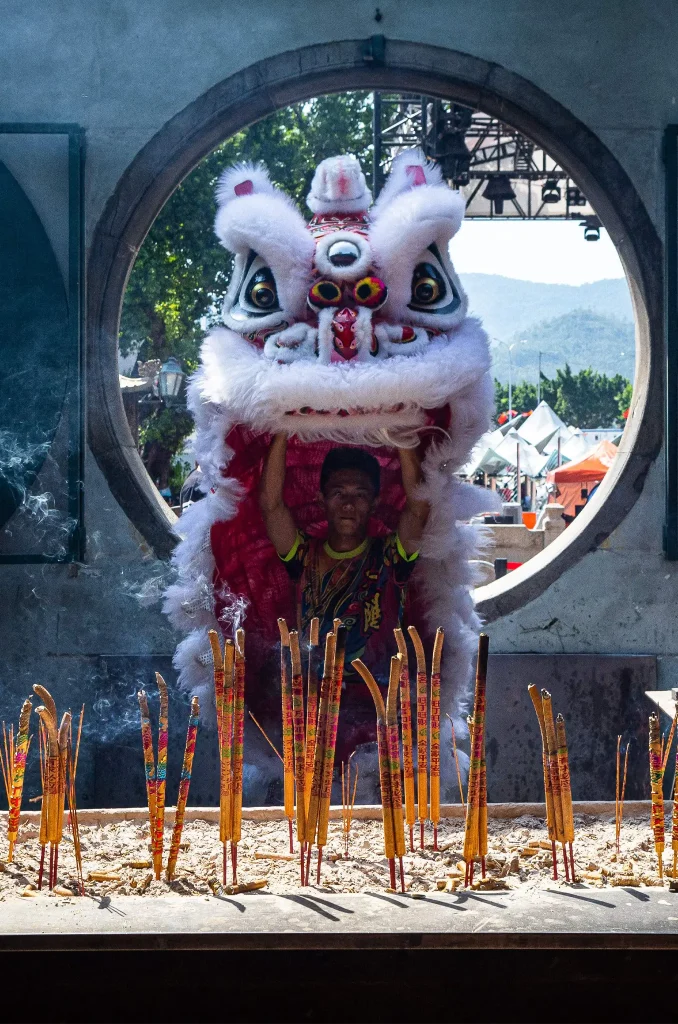 A lion prays at the A-Ma temple during a break in the 10th Lion Dance Championship MGM Cup in Macau on October 6, 2023. (Photo by Eduardo Leal / AFP) (Photo by EDUARDO LEAL/AFP via Getty Images)