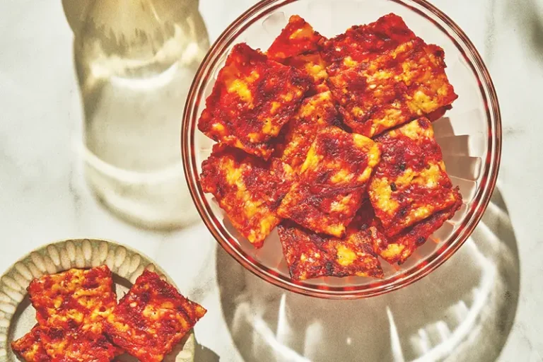 This image released by Voracious shows a recipe for Schiacciata, a versatile Tuscan bread, from the cookbook “Stuzzichini,” by Stef Ferrari. (Voracious via AP)