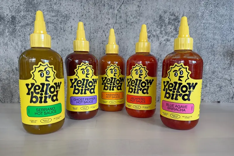 An assortment of Yellow Bird hot sauces are displayed in New York. (Katie Workman via AP)